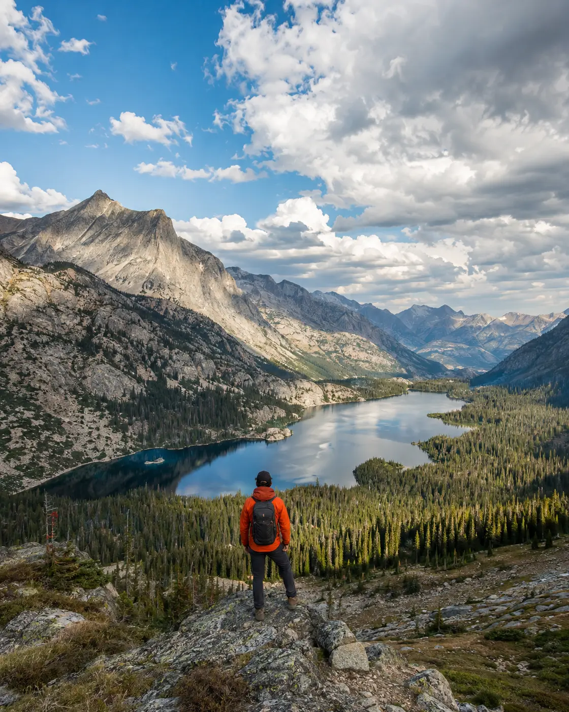 Hiker overlooking a dramatic American mountain landscape